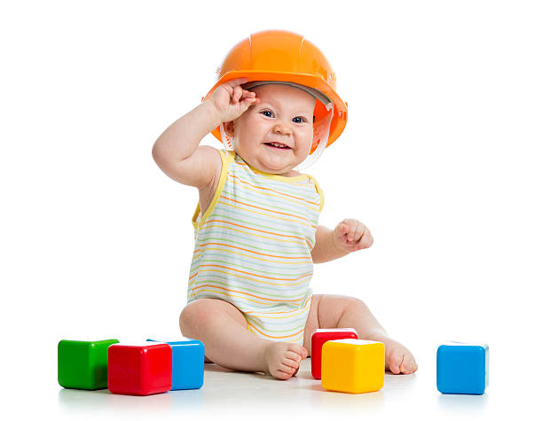 istock Baby boy playing with building blocks on a white background 178060385