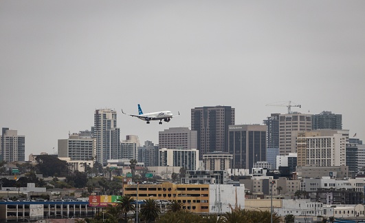San Diego, United States – November 01, 2023: An aerial view of a A Jetblue Airways plane approaching San Diego Airport prior to landing