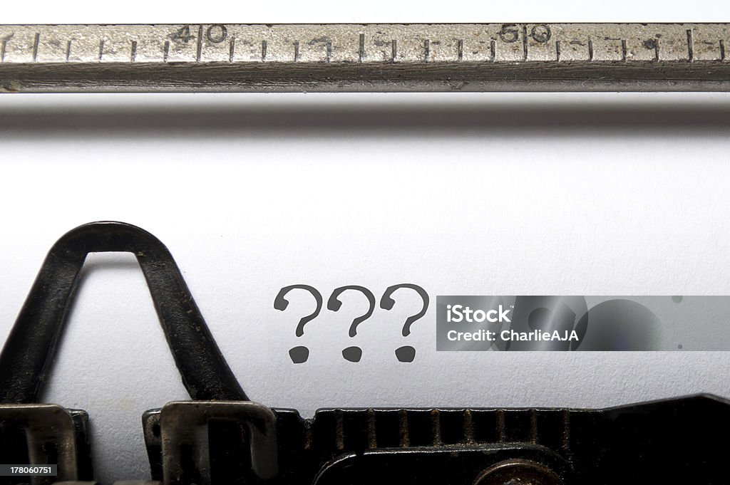 A type writer with question marks printed on the paper Three question marks printed on a vintage typewriter  Author Stock Photo