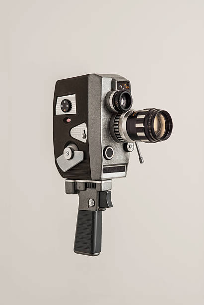 Vintage video camera isolated on white A retro cine camera on a plain grey background vintage video camera stock pictures, royalty-free photos & images