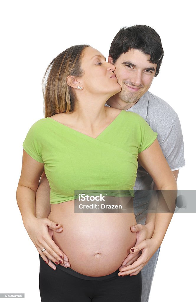 妊娠白人女性、ネイクドベリーキス夫 - 2人のロイヤリティフリーストックフォト
