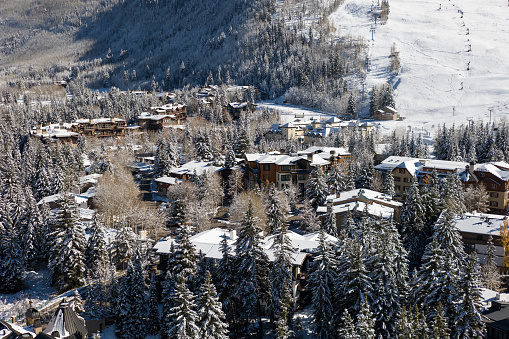 Aerial shot of Vail, a ski resort town in Eagle County, Colorado, on a sunny day after an early winter snowfall.