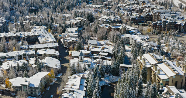 istock High Angle Drone Shot of Snowy Rooftops and Covered Bridge in Vail, CO 1780620052