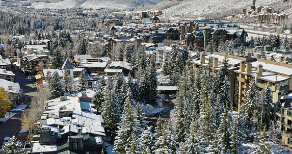 Aerial shot of Vail, a ski resort town in Eagle County, Colorado, on a sunny day after an early winter snowfall.