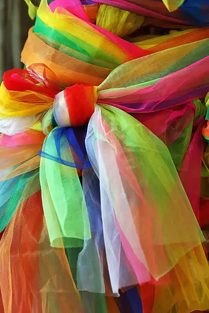 Colorful fabric tied to a tree