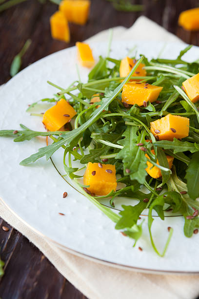 salad with chunks of pumpkin and green