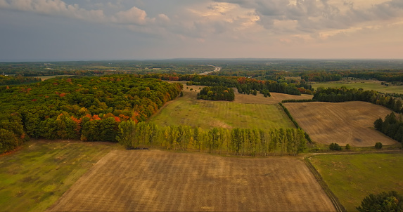 Aerial still of farmland near Shelby, a village in Oceana County in Michigan, on a Fall morning.