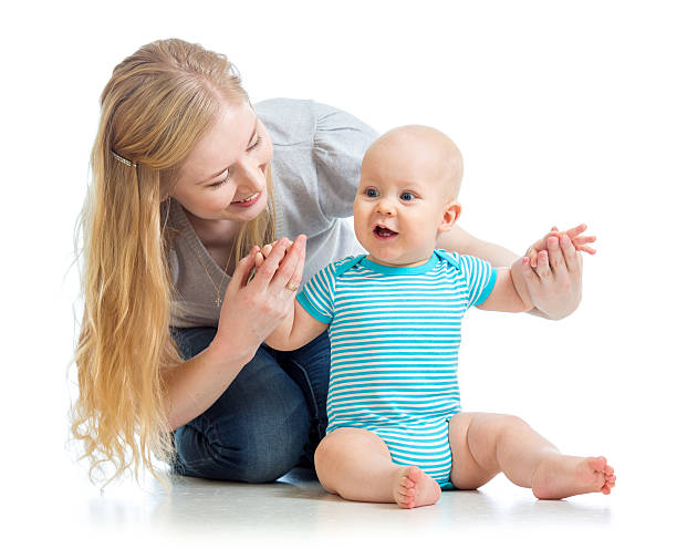 istock loving mother holding baby boy isolated on white 178066720