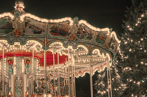 Christmas merry-go-round. Historic Carousel & Spinning Entertainment Equipment.
