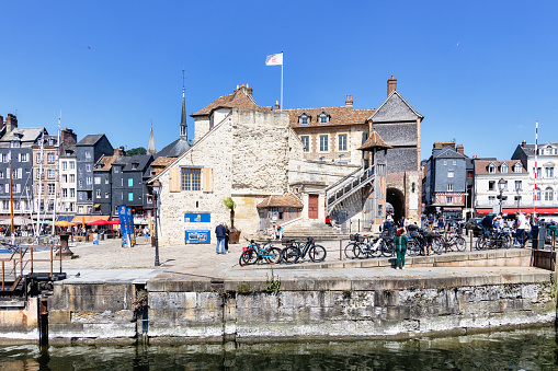 Honfleur, France - June 03, 2023: port of Honfleur with unidentified people in Calvados department, Normandy. Honfleur is known for its old port, characterized by its slate-covered houses