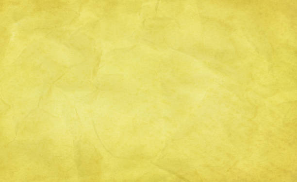 istock Yellow crumpled wavy paper poster - old background 1780674857