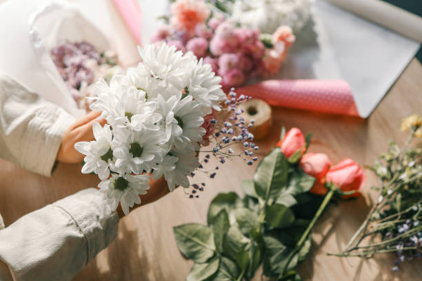 istock Florist at work. Woman making autumn floral decorations 1780695189