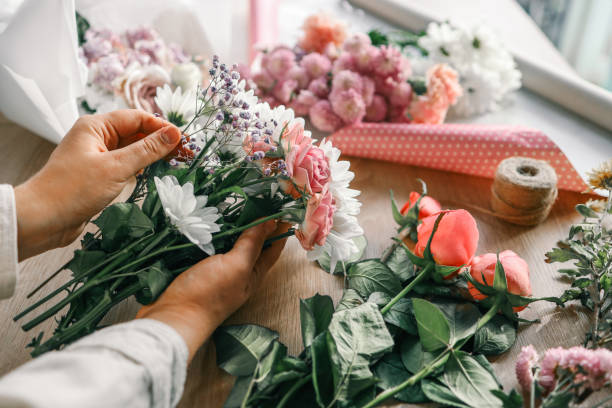 istock Florist at work. Woman making autumn floral decorations 1780695191