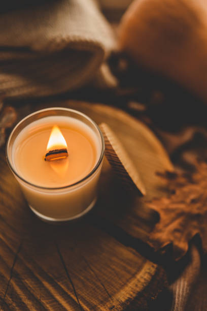 istock Burning candle in home interior, autumn aesthetics 1780697439