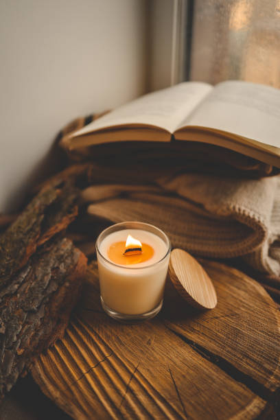 istock Burning candle in home interior, autumn aesthetics 1780697441