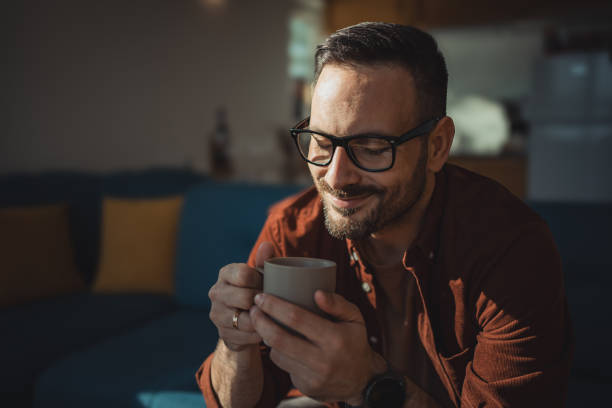 istock A middle-aged man enjoys his morning coffee in his cottage 1780699043
