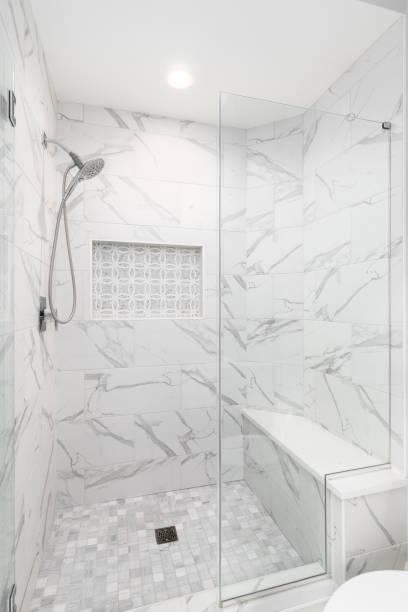 istock A shower with marble tiles with mosaic tile niche. 1780716424