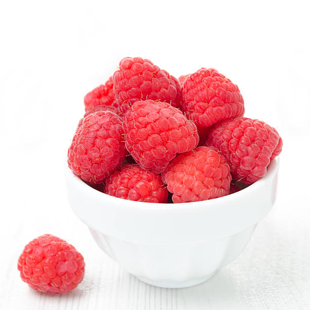 istock bowl with fresh raspberries on a white background close-up 178071682