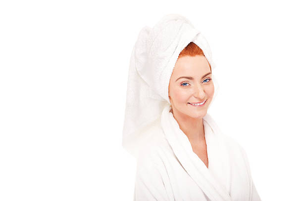 istock Beautiful woman in bathrobe smiling 178071782