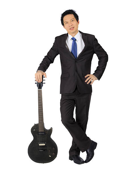 istock Asian business man with a black guitar 178072327