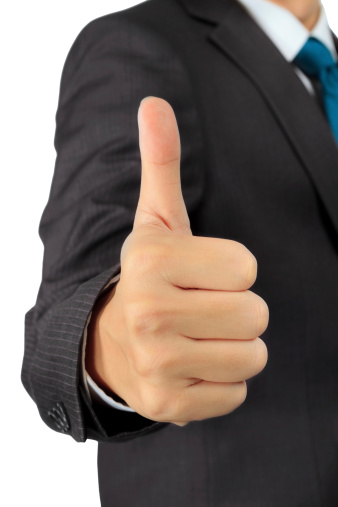Isolated closeup on a hand of business man with thumb up posture