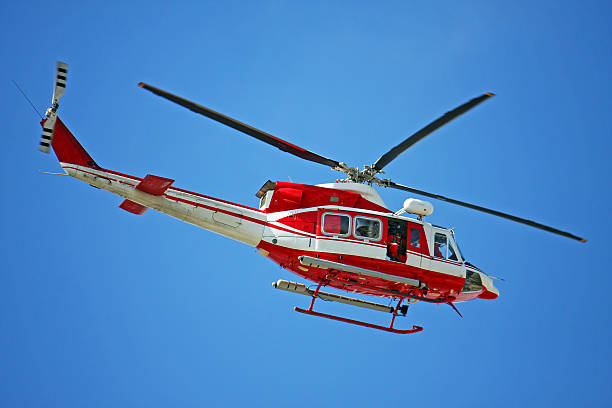 istock patrol helicopter of firefighters in blue sky over a fire 178072964