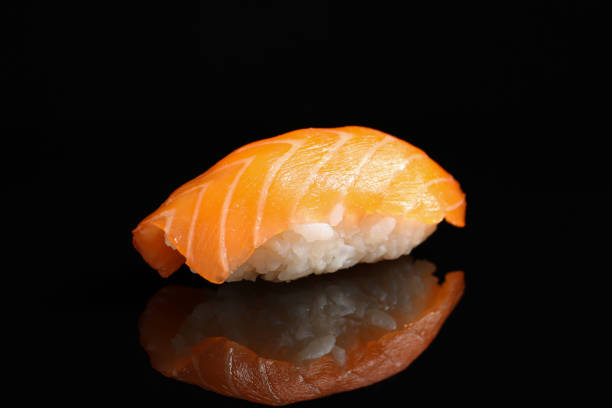 istock Delicious nigiri sushi with salmon on black background 1780731411