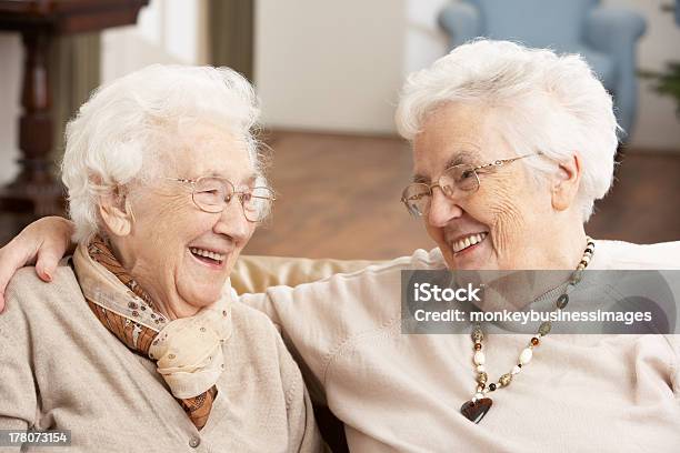 Two Senior Women Friends At Day Care Centre Stock Photo - Download Image Now - Senior Adult, Friendship, Happiness