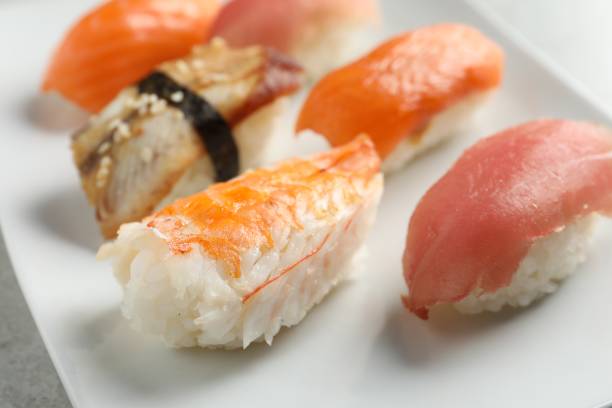istock Plate with delicious nigiri sushi on grey table, closeup 1780731966