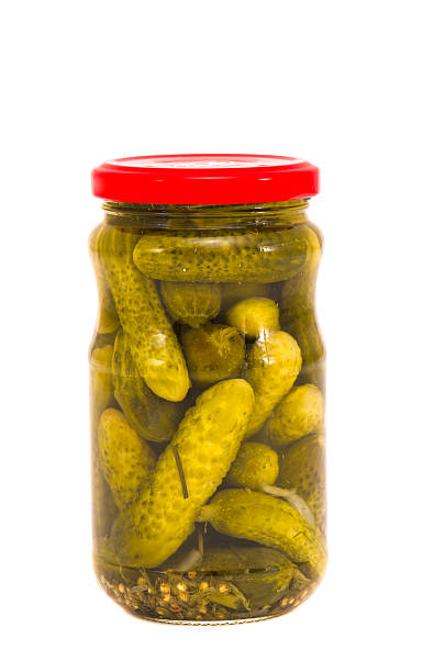 istock glass jar canned cucumbers on white 178073348