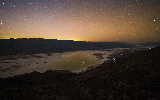 Night sky over the lake Hurricane Hilary created at Badwater Basin in Death Valley National Park
