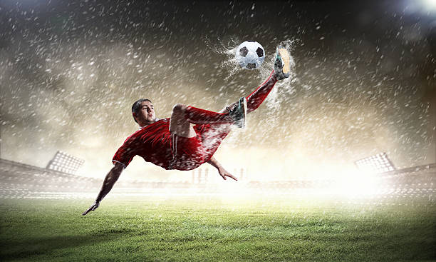 istock football player striking the ball 178074791