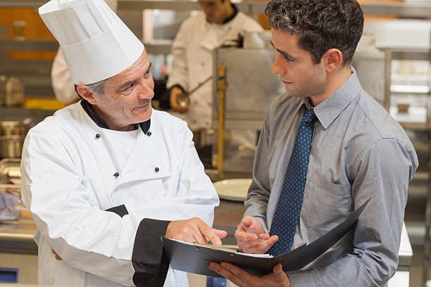 istock Waiter and chef discussing the menu 178075550