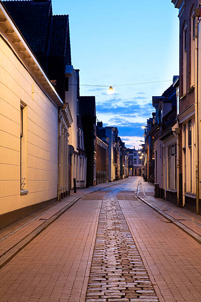 istock narrow street in Groningen at night 178075759