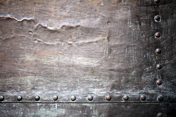 istock Black metal plate or armour texture with rivets 178076441