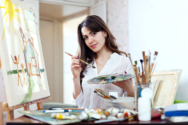 istock Young woman paints home of dreams 178077110