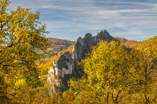 View of autumn landscape with The Lednica medieval castle in the White Carpathian Mountains, Slovakia, Europe.