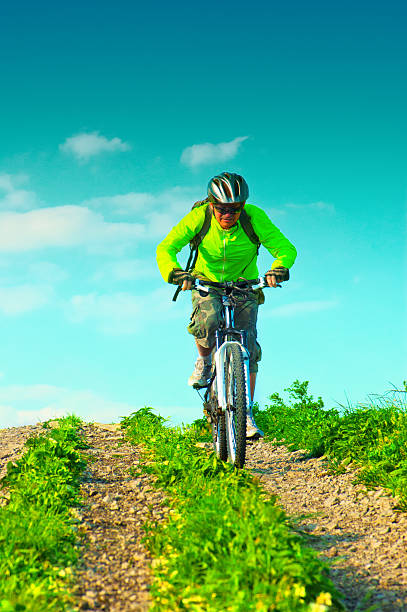 istock Cyclist rides downhill from mountain 178077716