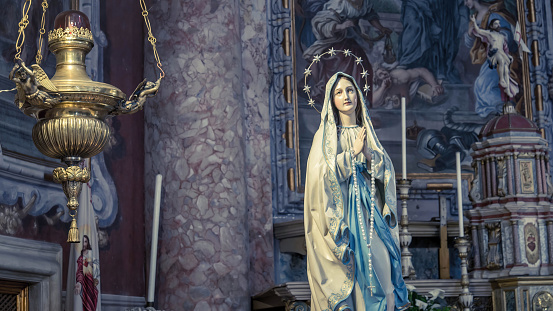 Vienna, Austria - May 2014: Virgin Mary sculpture, the mother of Jesus in the Christian religion. This statue is a symbol of devotion and faith.