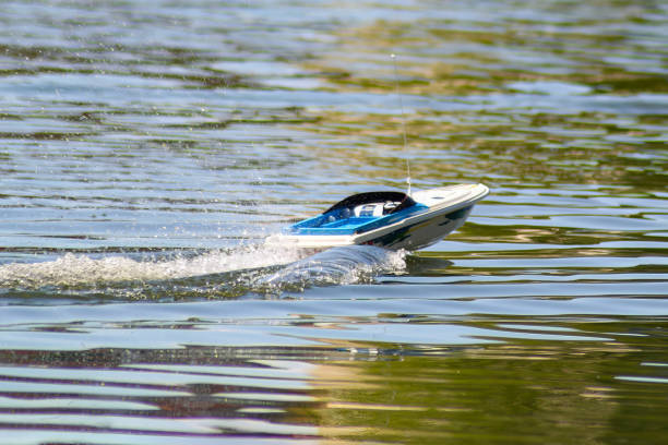 Travelers enjoy the water by renting a speed boat in sarangan lake, Magetan, East Java, Indonesia on July 08, 2003