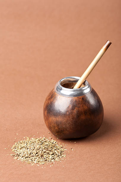 istock calabash and bombilla with yerba mate isolated on brown background 178080110