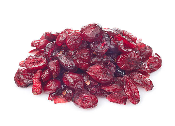 dried cranberry fruits isolated on white background stock photo
