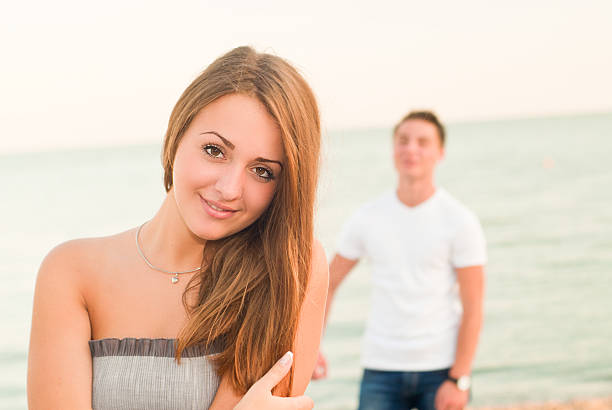 istock boy and girl on the beach 178080591