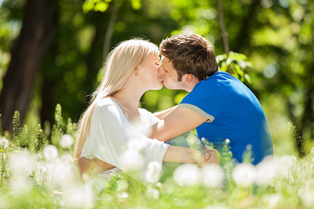 istock Happy couple kissing in the park 178080607