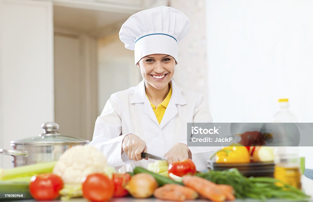 Happy  cook prepares vegetarian lunch Happy  cook prepares vegetarian lunch  at commercial kitchen Adult Stock Photo