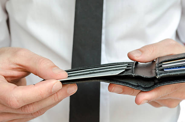 istock Man holding a wallet with credit cards 178081167