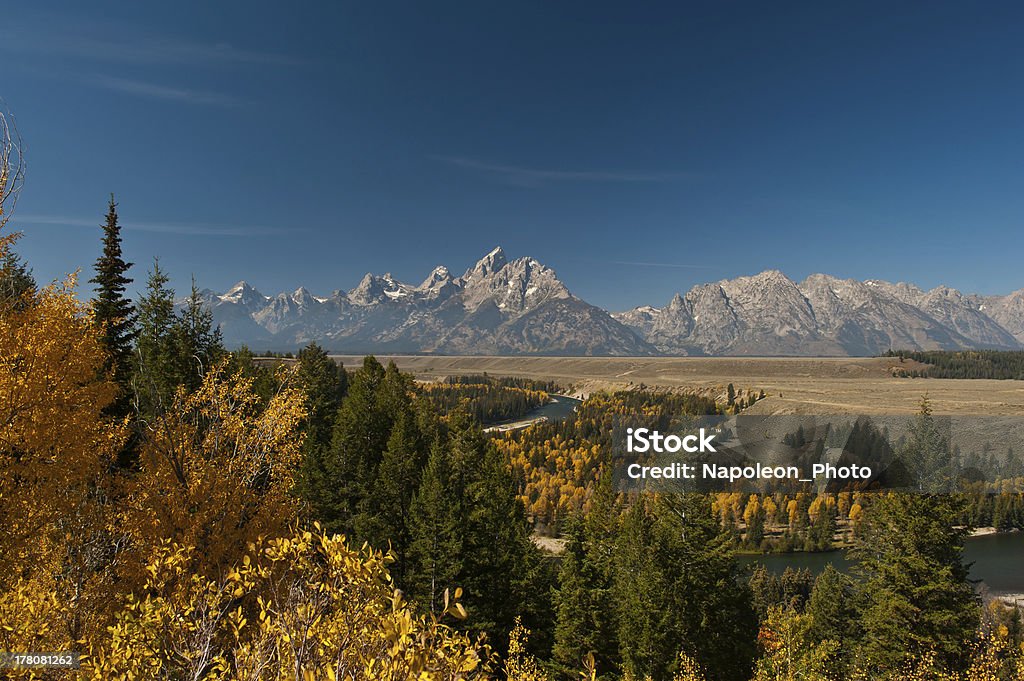 Snake River and Grand Tetons Fall color along the Snake River with the Grand Teton Range in the backgrond. Autumn Stock Photo