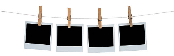 istock Blank Polaroid photographs hanging on a line 178081767