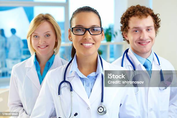 Pretty Clinician Stock Photo - Download Image Now - Doctor, Females, Group Of People