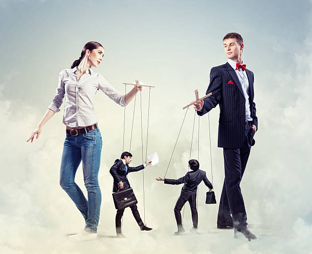 istock Businesspeople with marionettes 178081938